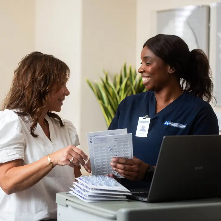 Caregiver and woman chatting