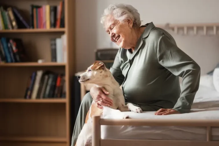 senior woman enjoying time with her little dog